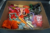 Box full of cookie cutters, rolling pin.