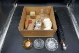 Ashtrays, parasol, head vase, candles. Corn.