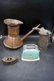 Antique copper pot, antique toaster, sad iron, antique can with spout.