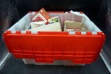 Heavy duty clear tote with red lid. Full of Christmas ornaments.