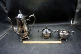 Silver service pieces.