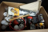 Box full of light bulbs, flashlights, supplies and more.