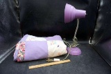 Handmade purple quilt, purple desk lamp.