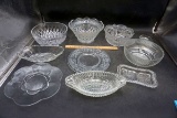 Large lot of clear glass bowls, plates, serving pieces.