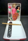 Vintage Barbies in case.