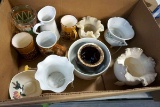 Box full of glassware, candleholders, and more.