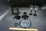 Black glassware, mirror, candle sticks.