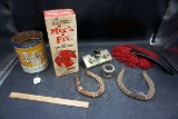 Horseshoes, duster, concrete patch, tin canister.