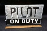 Pilot on duty metal sign.