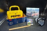 Plastic Pepsi, crate, artwork, dog comb, Powerball, and more.