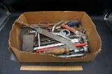 Box of tools, file, wrenches, screwdrivers, and more.