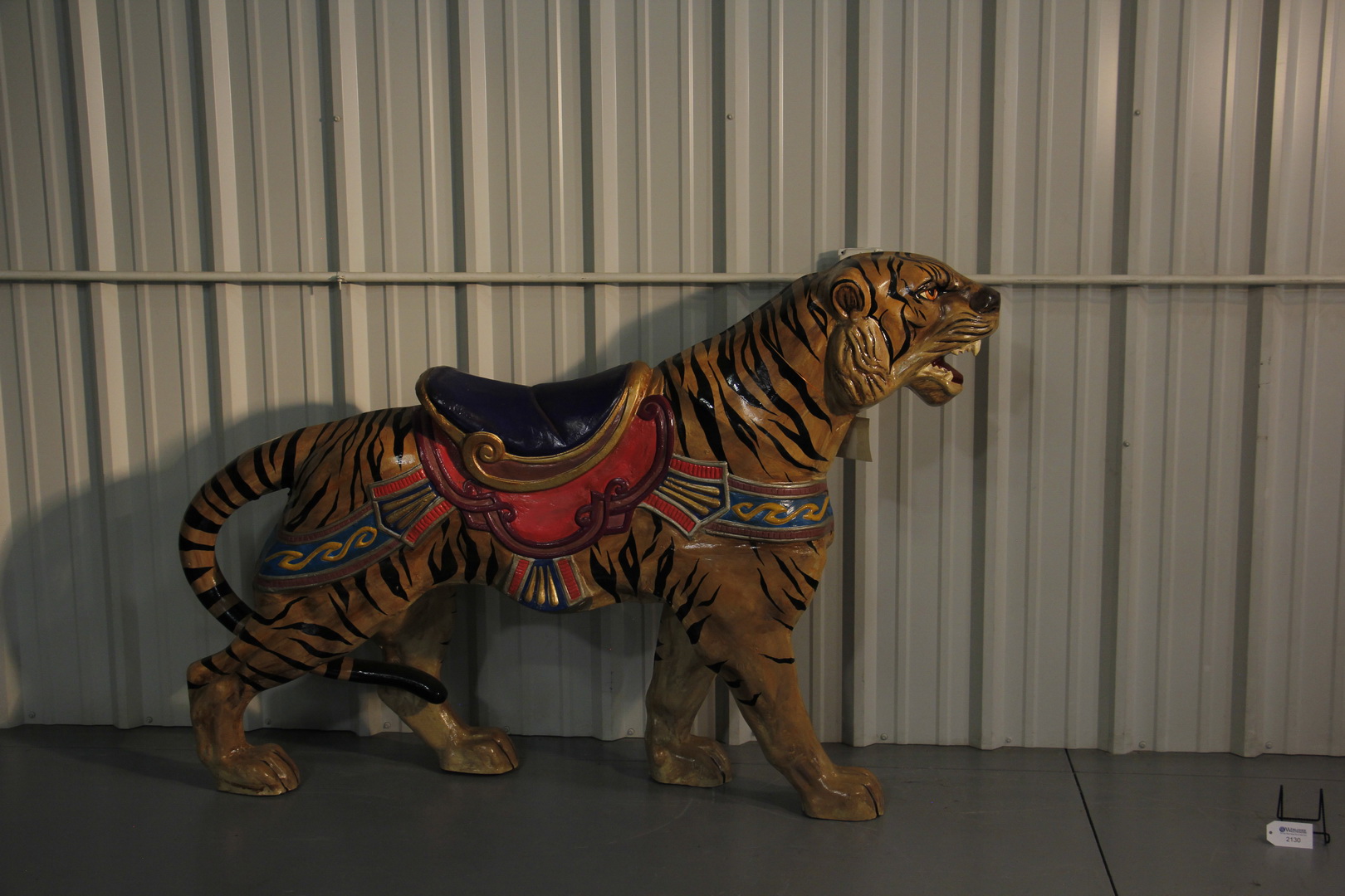 Salk & Holley ride a tiger carousel 
