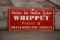 Whippet Automobile Dealer Embossed Tin Sign