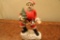 Porcelain Santa with Christmas Tree in hand. Plays 