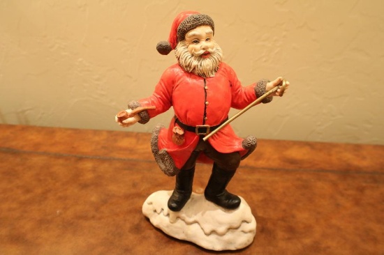 Porcelain Santa with a pipe and cane. Plays "Santa Clause Is Coming to Town" " 12"