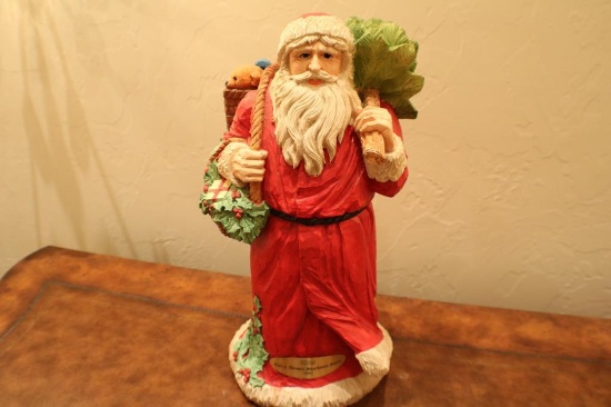Porcelain Santa with a basket over his shoulder