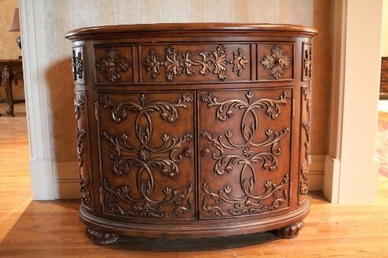 Ornate oval cabinet