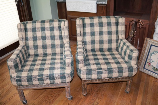 Two plaid chairs with wooden bottoms