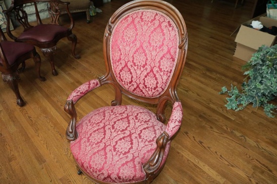Red armed padded chair
