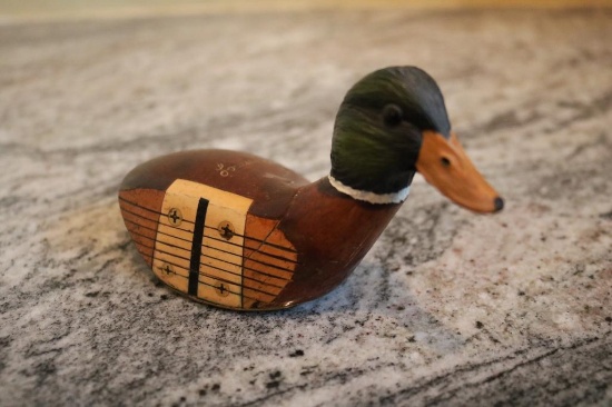 Paper weigh of a wooden driver and mallard duck head