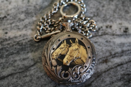 Pocket watch with halter horses on front