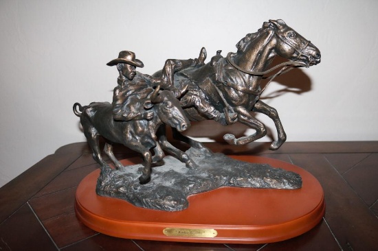 Bronze of a steer wrestler (Repro. $1,200 +/-)