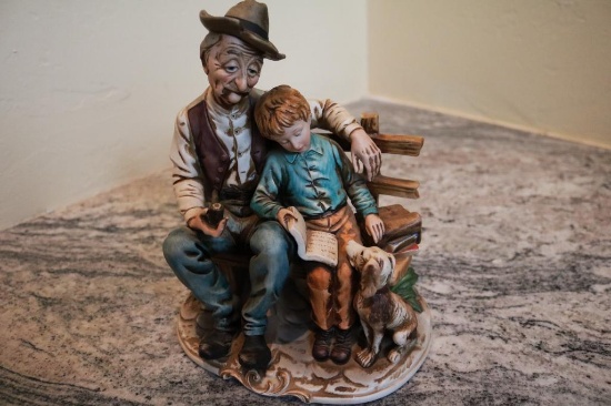 Porcelain piece of a man, boy, and dog sitting on a bench, Darte 9941