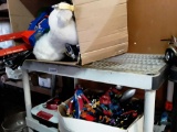 Air hockey table box full of toy electric guitars stuffed animals box full of action figures