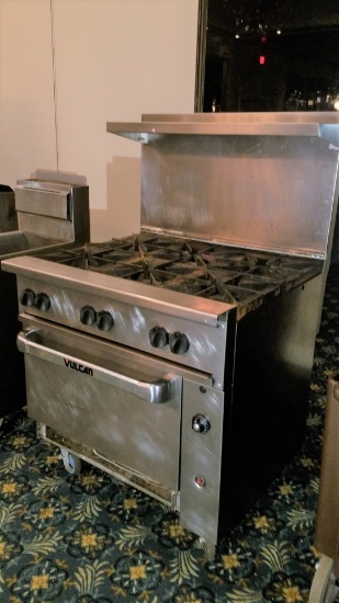 Vulcan 6 Burner Gas Stove with Under Oven and stainless steel back splash