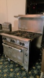 Vulcan 6 Burner Gas Stove with Under Oven and stainless steel back splash