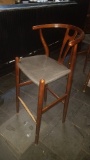 Wooden bar chair with wicker style seat