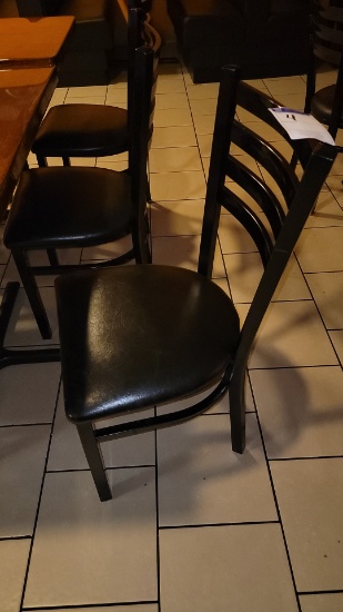 Black metal dining room chairs with vinyl cushion seats