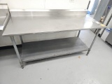 Stainless steel table with galvanized bottom shelf with Edlund can opener 72