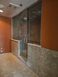 Glass framed steam shower system