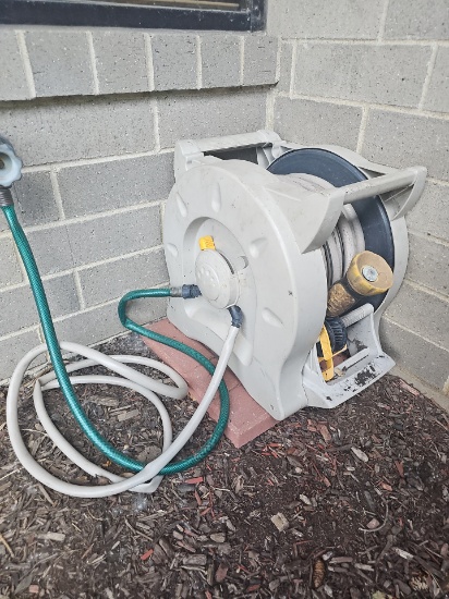 Out door hose reel with paving bricks