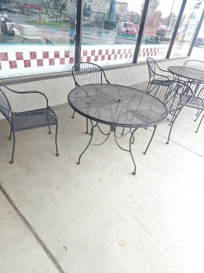 Out door cast iron style round table with 3 chairs
