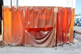 Lot of (4) large steel rolling frames welding screens with orange/amber sha
