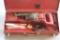 (1) Milwaukee Model 6509 electric Sawzall in red steel toolbox with assorte