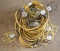 (2) strings 50' each of used yellow cord stringer work lights with cages