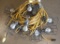 (2) strings 50' each of used yellow cord stringer work lights with cages