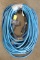 Lot of (2) approx. 50' each blue electric extension cords, both with multi-