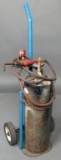 (1) small portable acetylene outfit: tank, hose, torch and gauge on small s