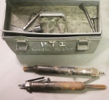 Grey plastic toolbox kit of (2) air needle sealers, wrenches/chisels, both