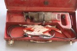 (1) Milwaukee Model 6509 electric Sawzall in red steel toolbox with assorte