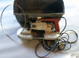 Grey plastic toolbox/kit with one Milwaukee Model #6225 porta band saw and