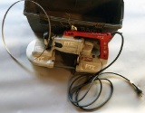 Grey plastic toolbox/kit with one Milwaukee Model #6225 porta band saw and