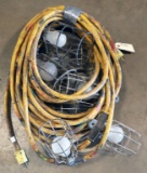 (2) strings 50' each of used yellow cord stringer work lights with cages