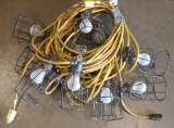(2) strings 50' each of used yellow cord stringer work lights with cages