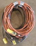 Lot of (4) approx. 50' each electric extension cords: (2) black. (1) red &