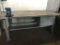 **INSIDE BUILDING B: Green/grey all steel workbench with vise, 34